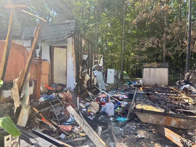Gutted fire-damaged interior stripped back to the studs and joists